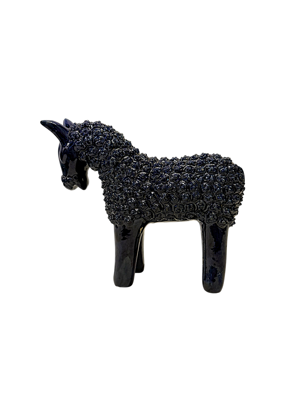 Perfil de figura de caballo en barro esmaltado azul, pieza de arte popular michoacano de la colección de lujo de Mansión Iturbe